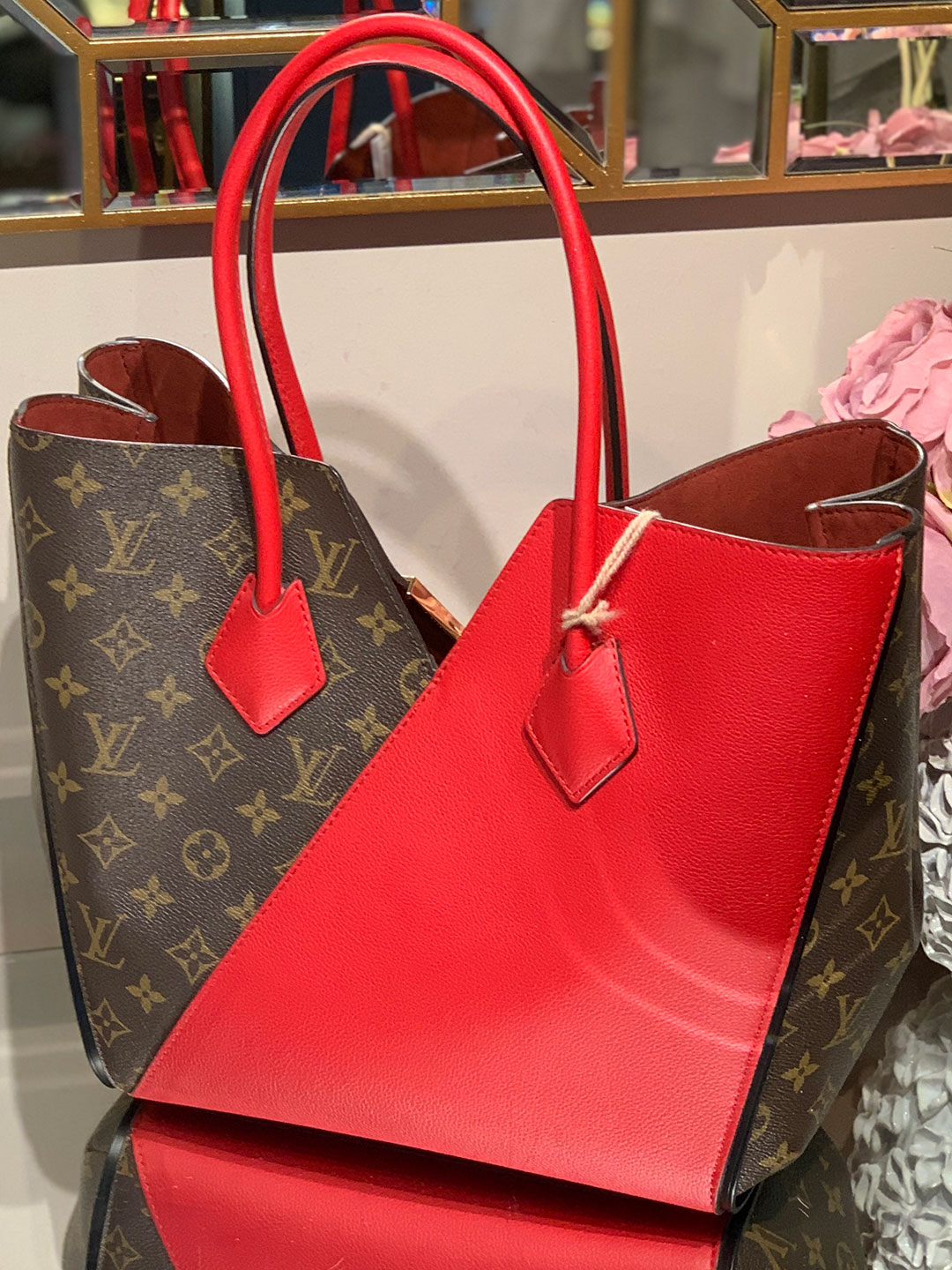 The Louis Vuitton Kimono Tote - a mix of traditional and a POP of color . # louisvuitton #luxuryhandbags #shoppreowned